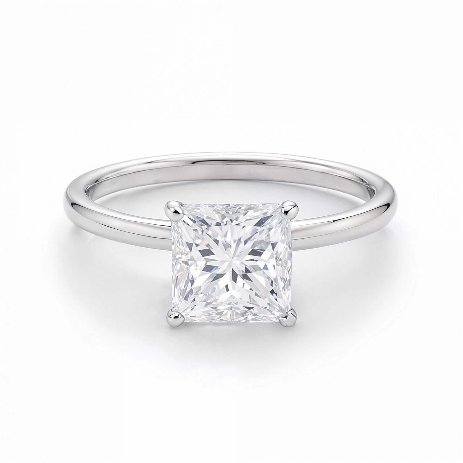 Stunning 1 1/2 carat princess-cut diamond solitaire ring from Ella, featuring a timeless design in polished 14K white gold.